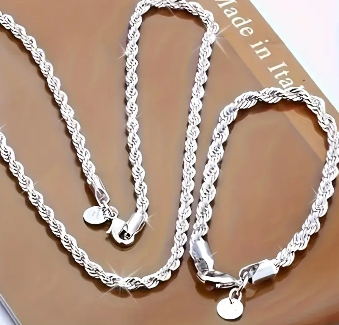 A stunning 925 Sterling Silver matching bracelet and chain