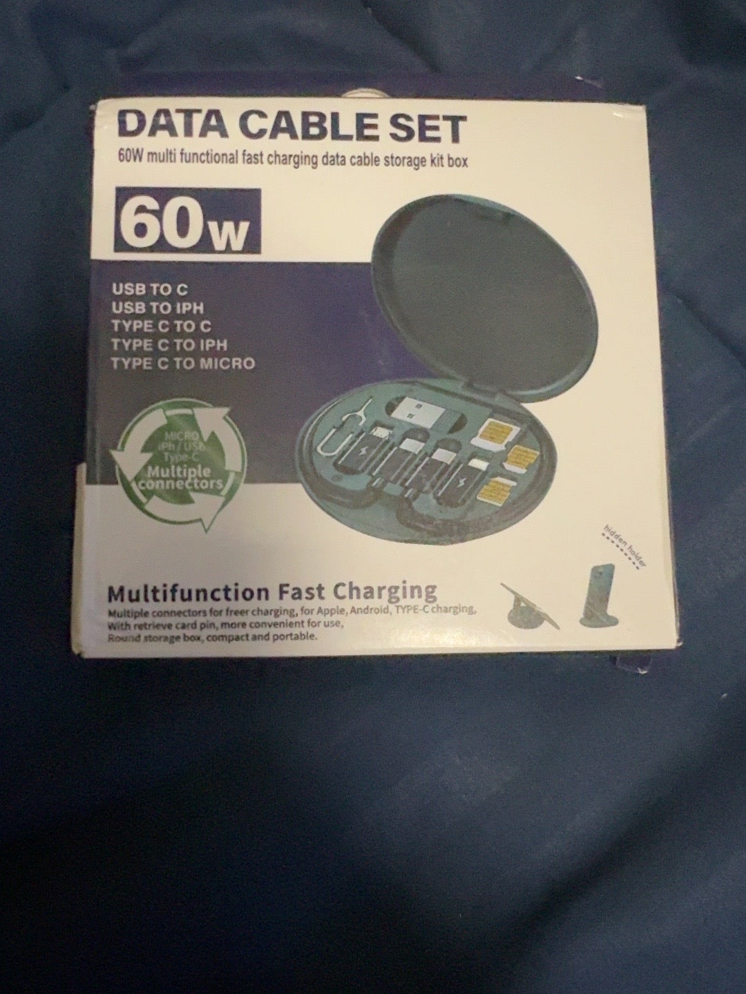Multi-connector data cable set retail packaging showing round case and built-in phone holder