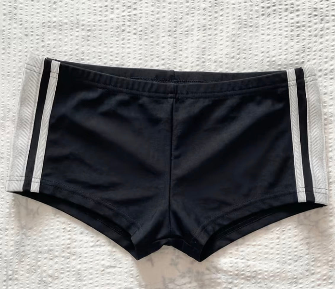 Front of black women's mini shorts with white side stripes