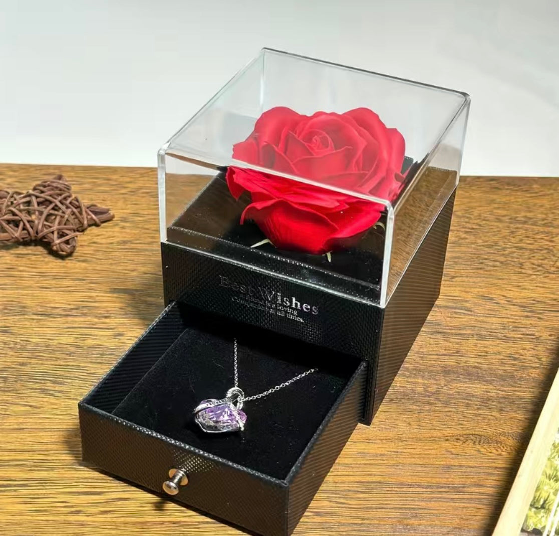 Present a rose to a couple with a concealed necklace nestled within the pullout drawer