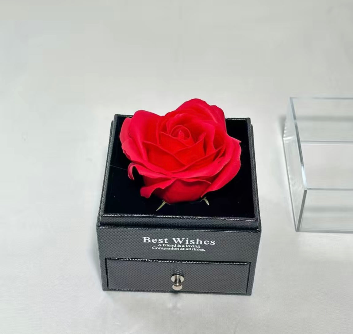 Present a rose to a couple with a concealed necklace nestled within the pullout drawer
