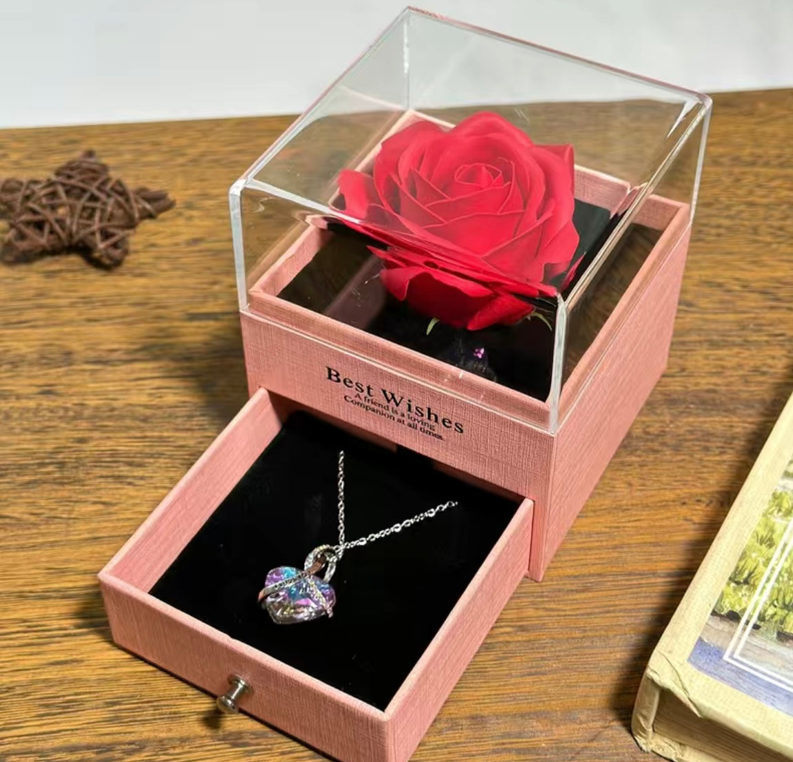 Present a rose to a couple with a concealed necklace nestled within the pullout drawer
